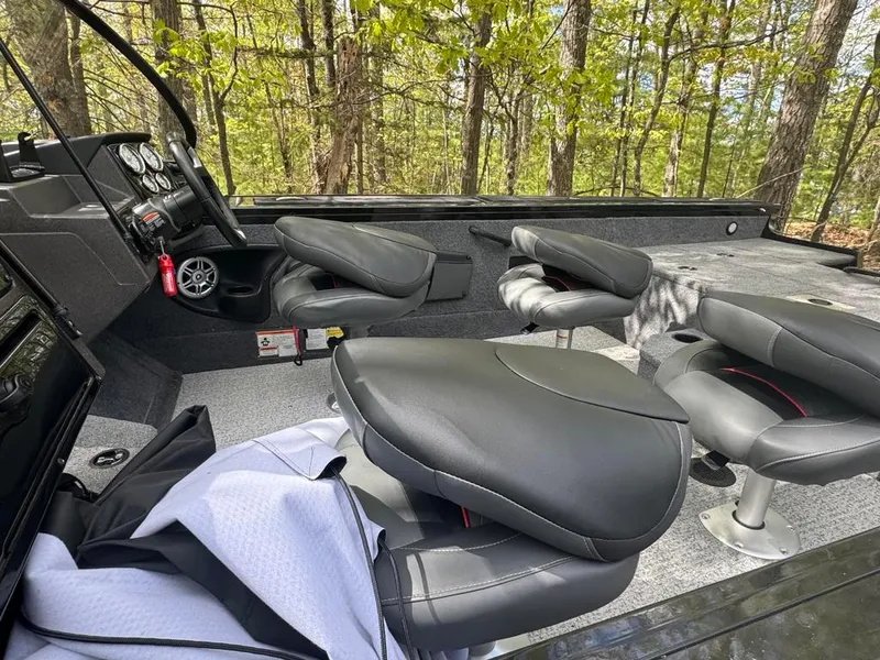 Slide: The Image of Interior of 2022 Tracker V-18 Targa boat with gray seating and dashboard controls. - 7