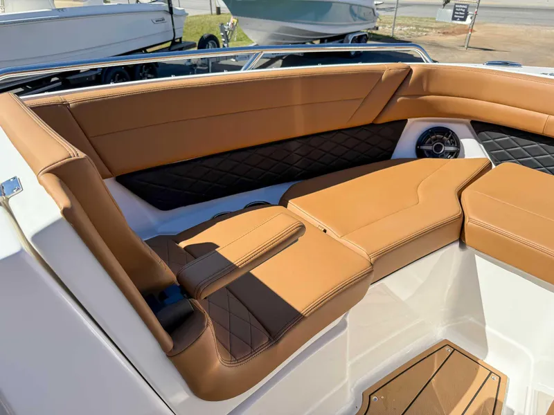 Slide: The Image of Luxurious interior of 2025 Chaparral 267 SSX boat with tan leather seating. - 14