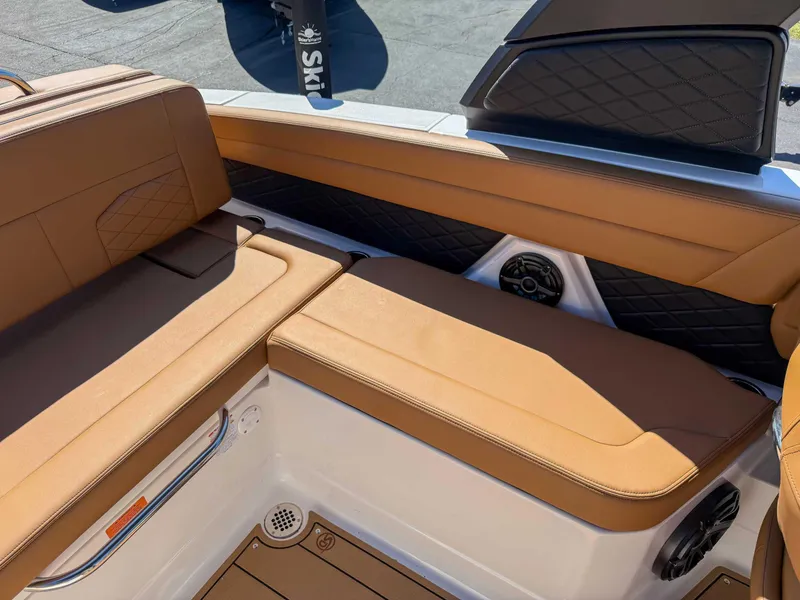 Slide: The Image of Luxurious tan seating in 2025 Chaparral 267 SSX boat interior. - 20