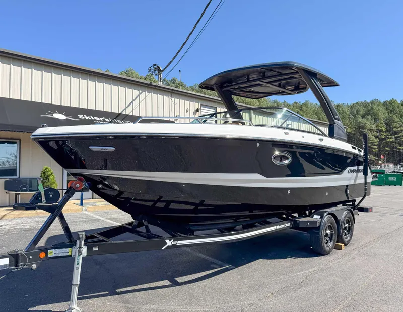 Slide: The Image of 2025 Chaparral 267 SSX boat on trailer, parked outside dealership. - 3