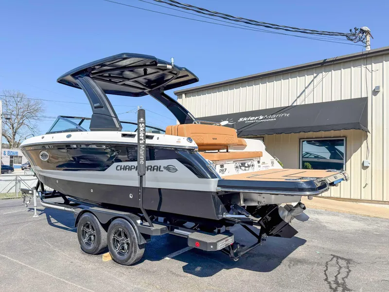 Slide: The Image of 2025 Chaparral 267 SSX boat on trailer outside Skier's Marine dealership. - 8