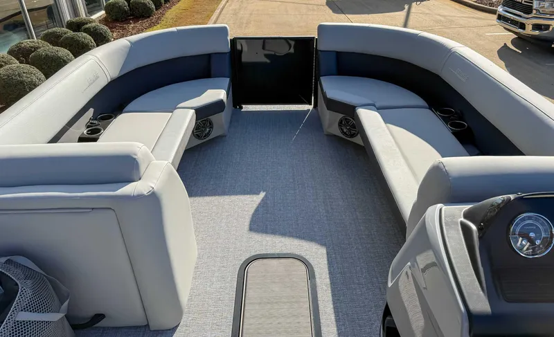 Slide: The Image of 2025 Harris Cruiser 230 CWDH pontoon boat interior with gray seating and cup holders. - 10