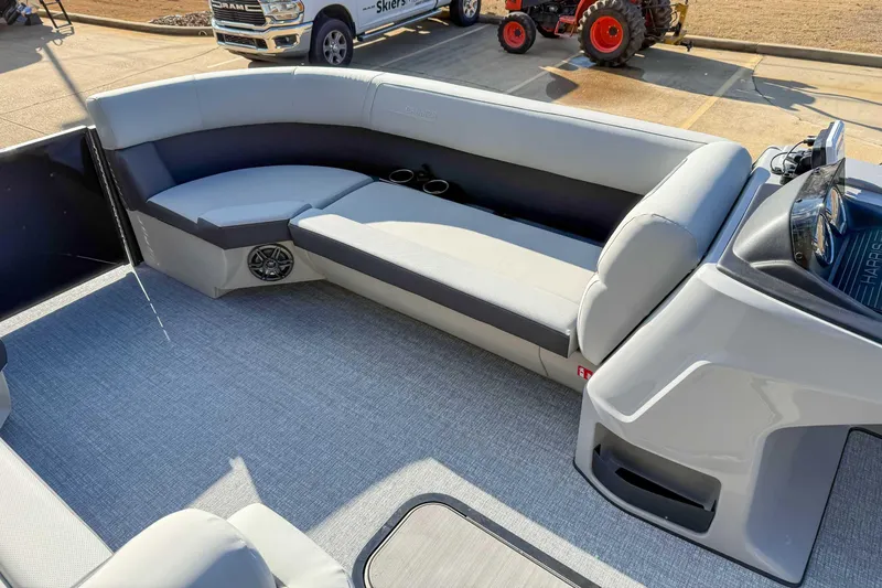 Slide: The Image of 2025 Harris Cruiser 230 CWDH boat interior with gray seating and modern design. - 12