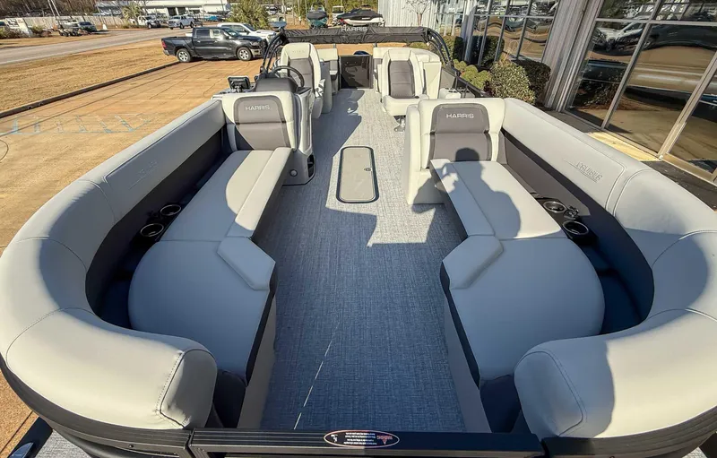 Slide: The Image of 2025 Harris Cruiser 230 CWDH pontoon boat with spacious seating and modern design. - 13