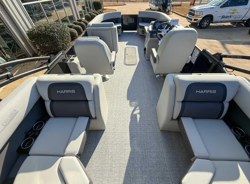 Slide: The Image of 2025 Harris Cruiser 230 CWDH pontoon boat interior with plush seating and modern design. - 9