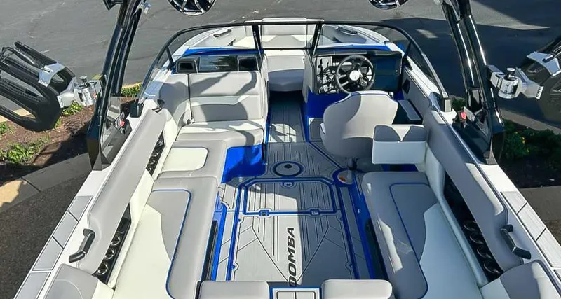 Slide: The Image of 2024 Moomba Mojo boat interior with spacious seating and modern design. - 12