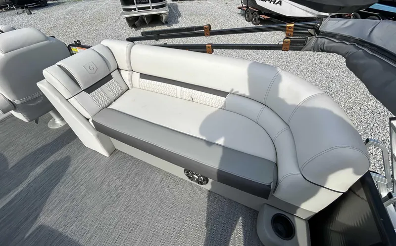 Slide: The Image of 2022 Godfrey Sweetwater boat seating with gray and white upholstery. - 12