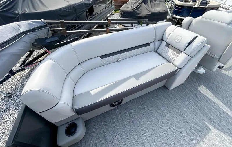 Slide: The Image of 2022 Godfrey Sweetwater boat seating with gray upholstery and stylish design. - 13