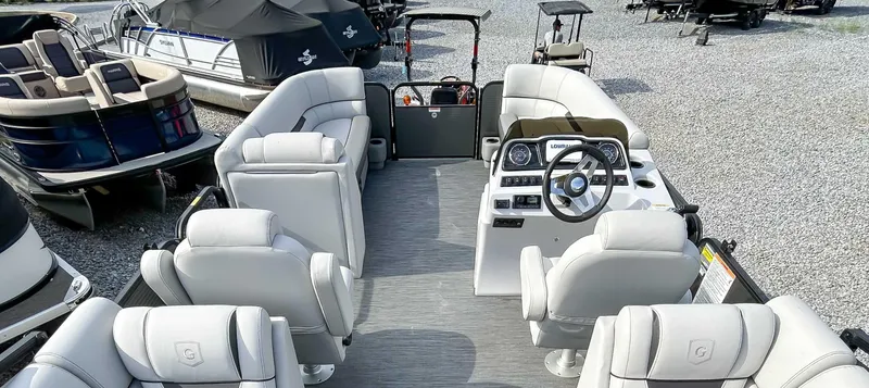 Slide: The Image of 2022 Godfrey Sweetwater pontoon boat interior with plush seating and modern dashboard. - 8