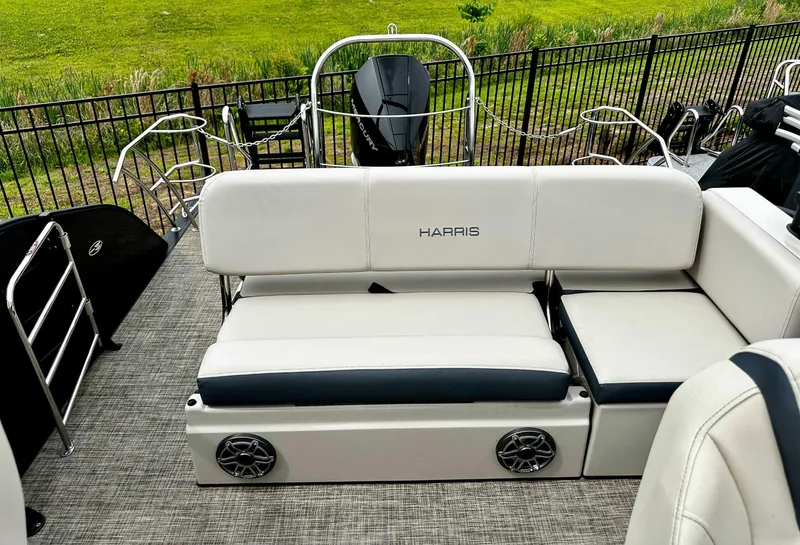 Slide: The Image of 2023 Harris Grand Mariner 230 boat interior with white seating and speaker system. - 20