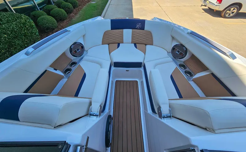 Slide: The Image of 2021 MasterCraft X22 boat interior with luxurious seating and modern design. - 11