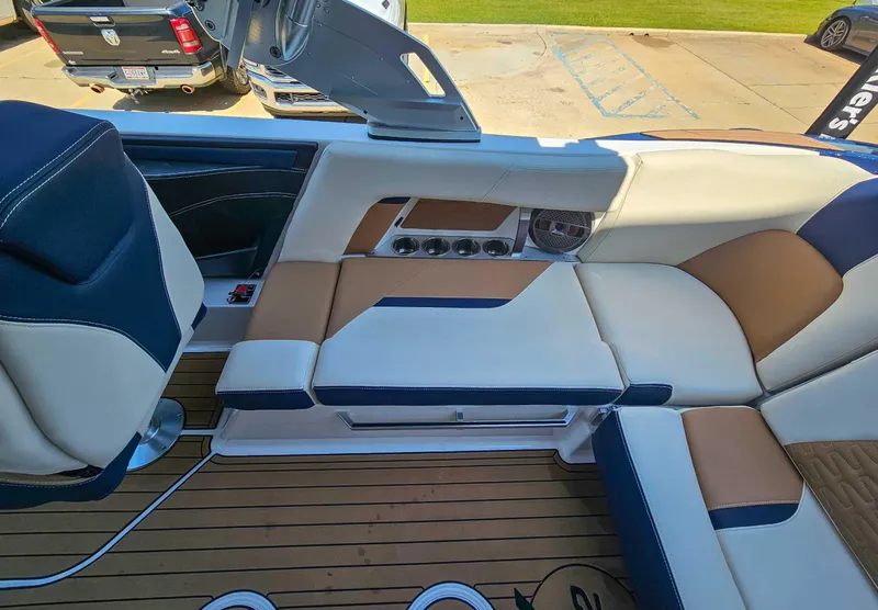 Slide: The Image of 2021 MasterCraft X22 boat interior with luxurious seating and modern design. - 15