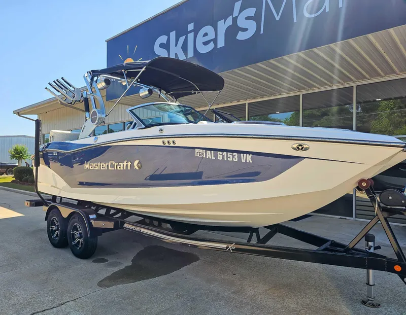 Slide: The Image of 2021 MasterCraft X22 boat on trailer outside Skier's Marine dealership. - 3
