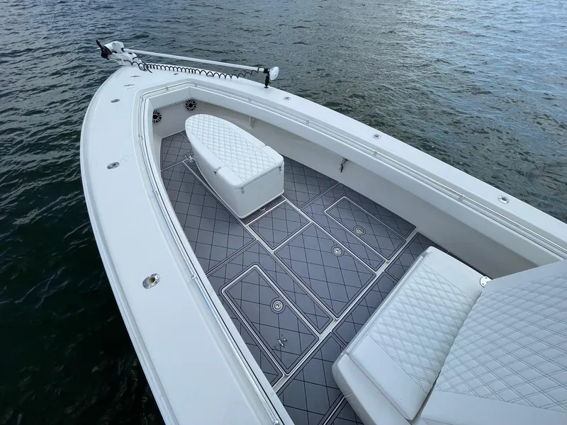 Slide: The Image of 2009 Contender 39 Tournament boat with sleek deck design on water. - 17