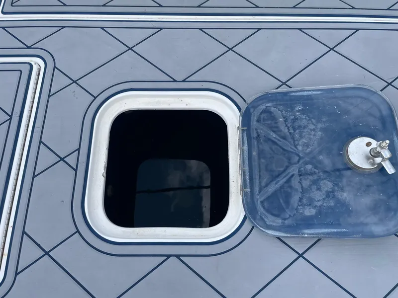 Slide: The Image of Open hatch on 2009 Contender 39 Tournament boat deck with geometric pattern. - 22