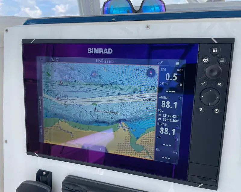 Slide: The Image of Simrad navigation display on 2009 Contender 39 Tournament boat, showing marine chart and data. - 23