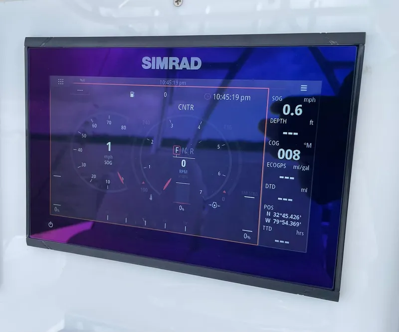 Slide: The Image of Simrad display on 2009 Contender 39 Tournament showing navigation and engine data. - 24