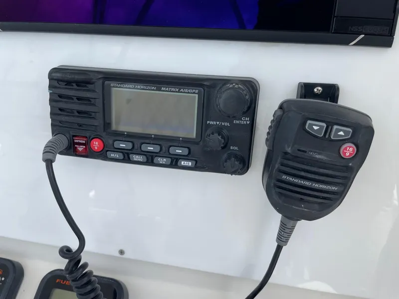 Slide: The Image of Standard Horizon marine radio on 2009 Contender 39 Tournament boat dashboard. - 29