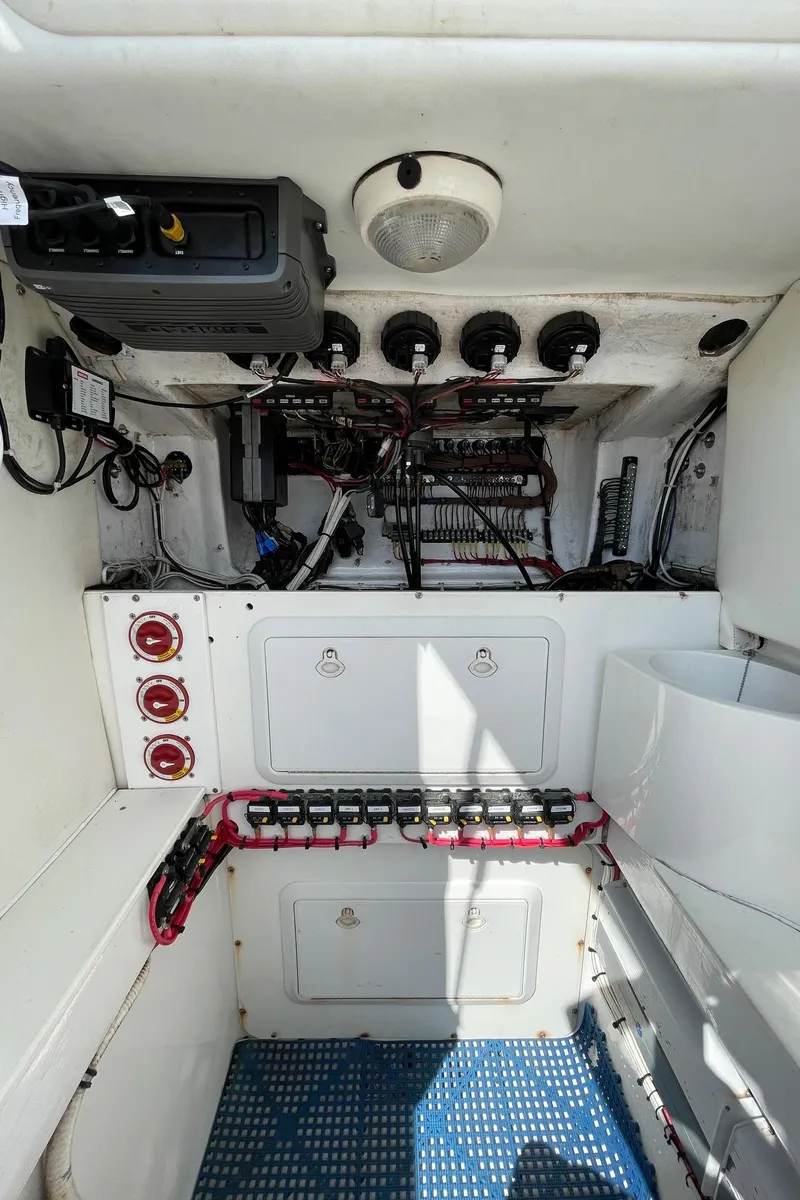 Slide: The Image of Electrical panel of 2009 Contender 39 Tournament boat, featuring wiring and controls. - 41
