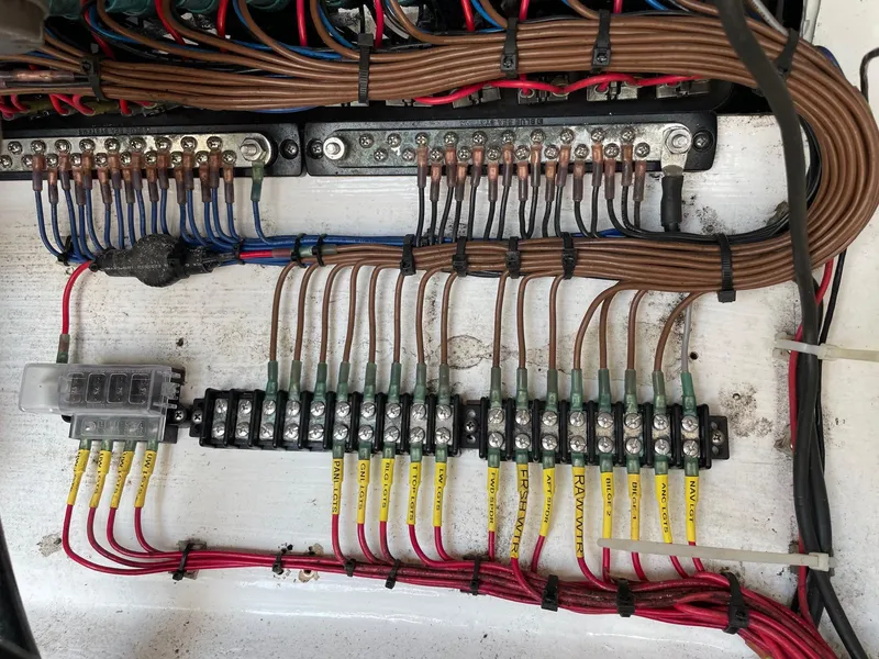 Slide: The Image of Electrical wiring panel on a 2009 Contender 39 Tournament boat. - 42