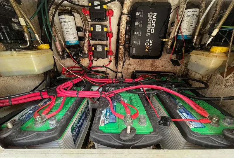 Slide: The Image of Electrical system of a 2009 Contender 39 Tournament boat with batteries and wiring. - 43