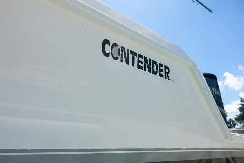 Slide: The Image of 2009 Contender 39 Tournament boat, close-up of logo on white hull. - 44