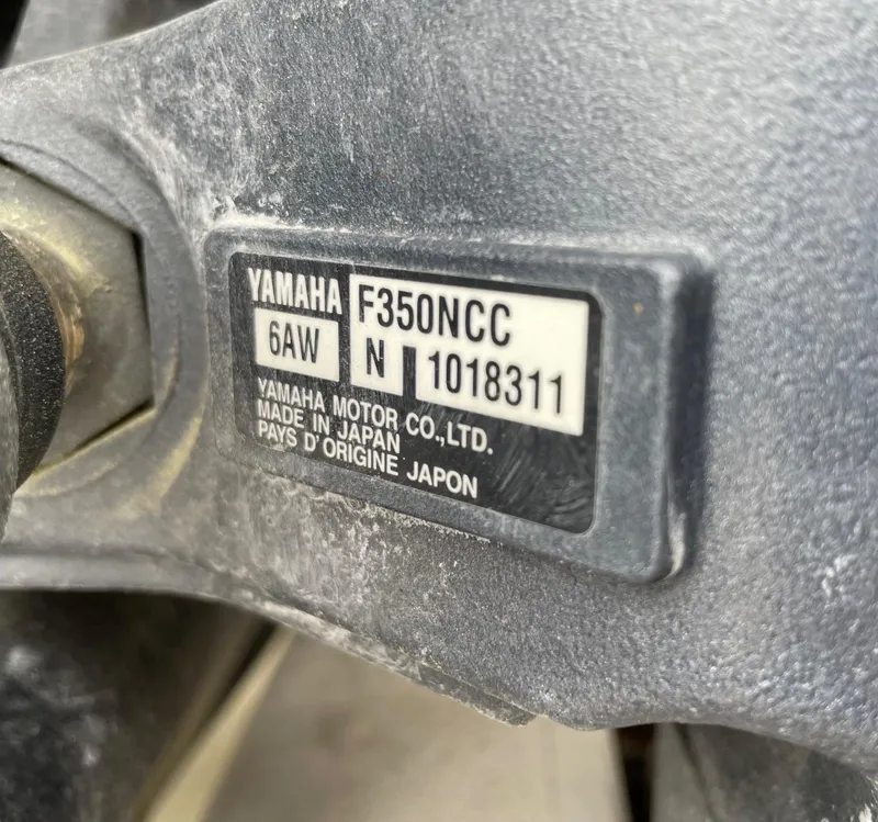 Slide: The Image of Close-up of a Yamaha F350NCC engine label on a 2009 Contender 39 Tournament boat. - 47