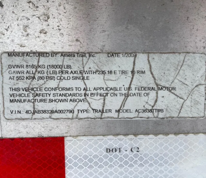 Slide: The Image of Label on a 2009 Contender 39 Tournament trailer, detailing weight and safety standards. - 48