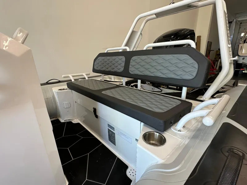 Slide: The Image of 2025 Highfield Sport 560 boat interior with cushioned seating and modern design. - 13