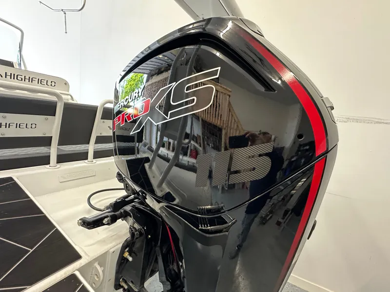 Slide: The Image of 2025 Highfield Sport 560 with Mercury Pro XS outboard engine, showcasing sleek design and power. - 16