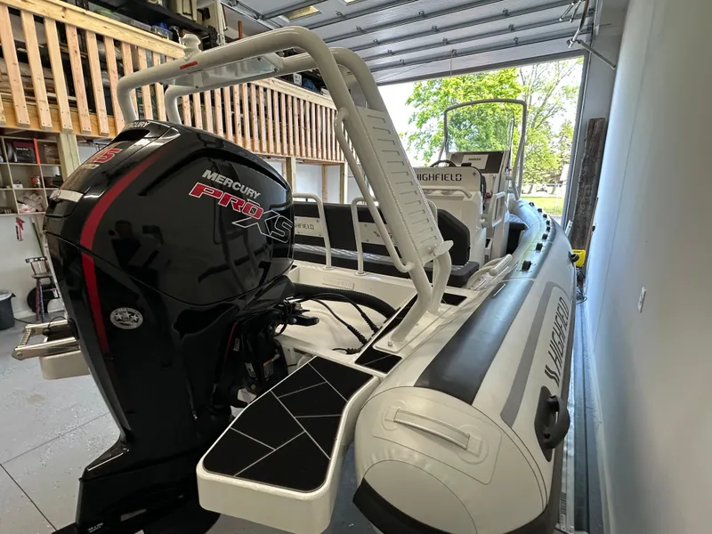 Slide: The Image of 2025 Highfield Sport 560 boat with Mercury Pro XS engine in a garage. - 17