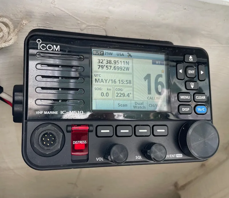 Slide: The Image of VHF marine radio on a 2022 Pathfinder 2600 TRS, displaying coordinates and channel information. - 12