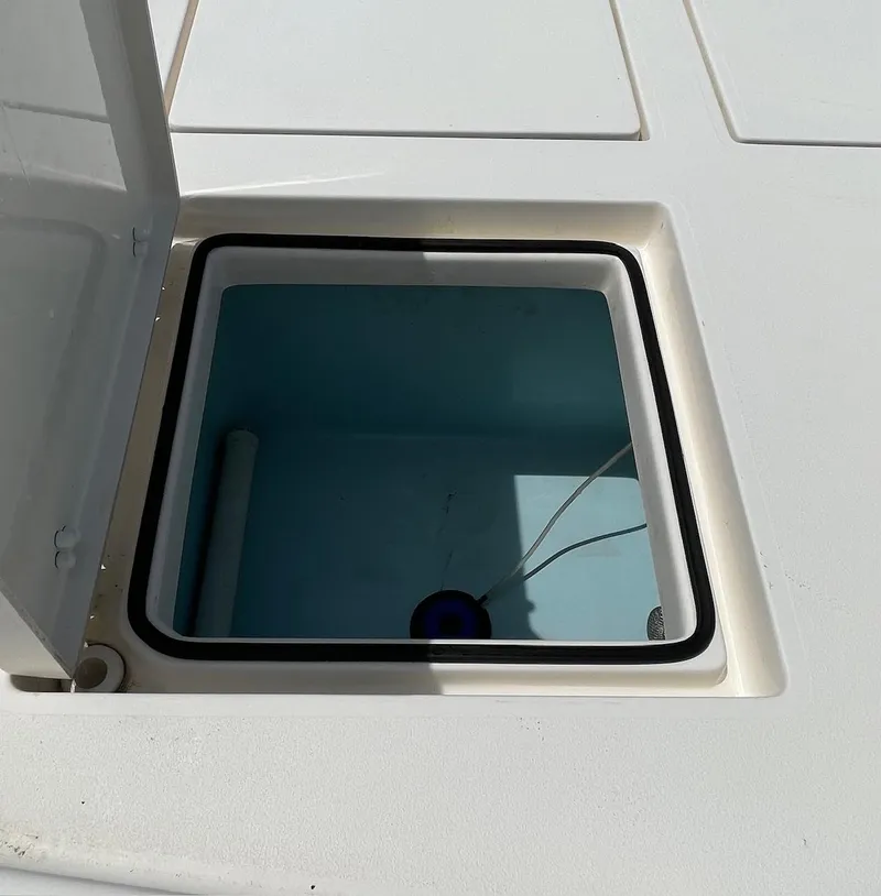 Slide: The Image of Open storage compartment on 2022 Pathfinder 2600 TRS boat deck. - 29