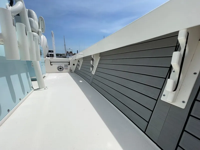 Slide: The Image of 2022 Pathfinder 2600 TRS boat deck with rod holders and sleek design. - 30