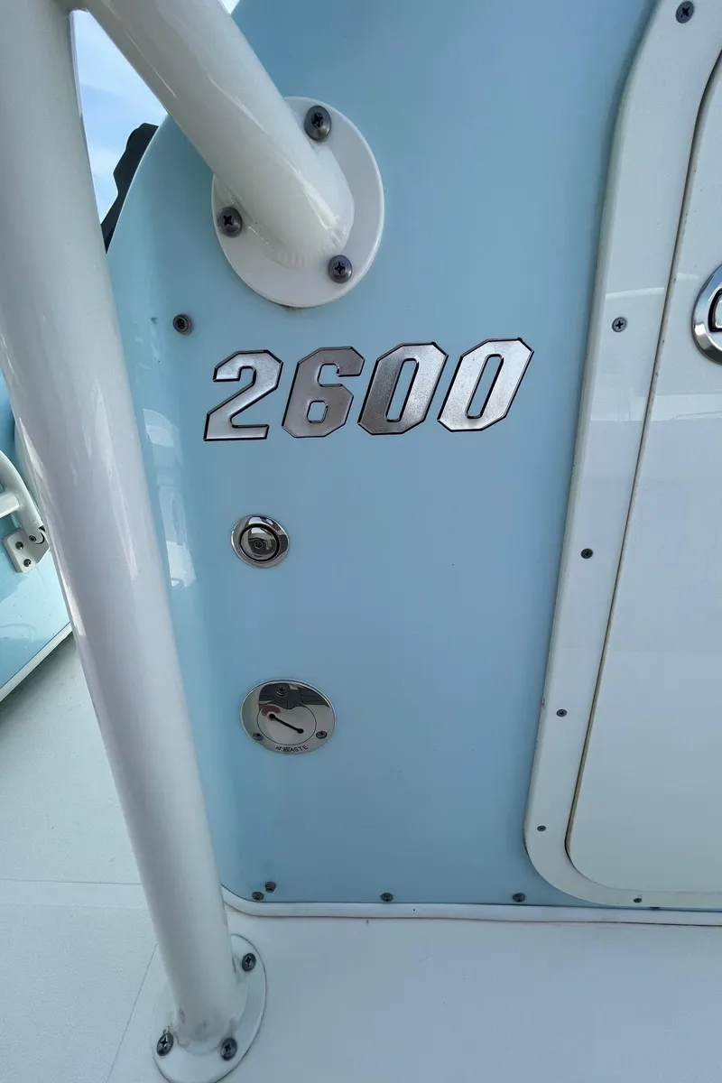 Slide: The Image of 2022 Pathfinder 2600 TRS boat detail with model number on light blue surface. - 31