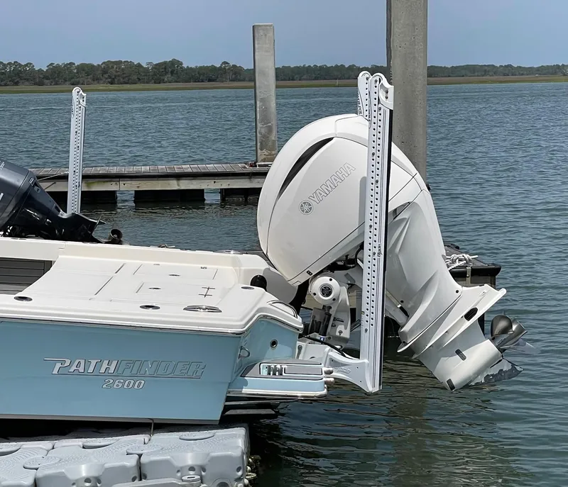 Slide: The Image of 2022 Pathfinder 2600 TRS boat docked with Yamaha outboard motor. - 5
