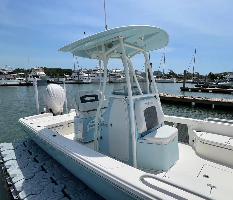 Slide: The Image of 2022 Pathfinder 2600 TRS boat docked at marina, featuring sleek design and modern amenities. - 8