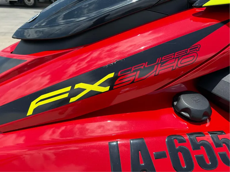 Slide: The Image of 2022 Yamaha FX Cruiser SVHO, red with bold graphics, close-up view. - 3
