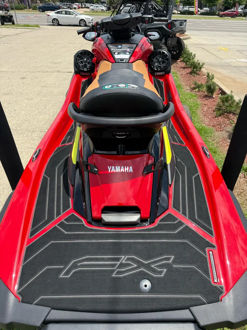 Slide: The Image of 2022 Yamaha FX Cruiser SVHO in vibrant red, parked outdoors. - 8