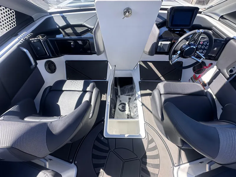 Slide: The Image of 2025 Scarab 235 LX boat interior with modern seating and control panel. - 11