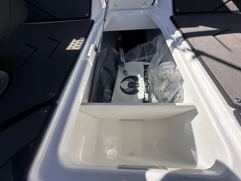 Slide: The Image of Storage compartment of 2025 Scarab 235 LX boat, featuring sleek design and ample space. - 15