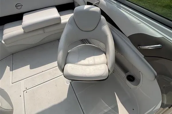 Slide: The Image of 2011 Crownline 220LS boat interior with white seating and modern design. - 27