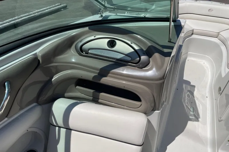 Slide: The Image of Interior of a 2011 Crownline 220LS boat, featuring sleek seating and dashboard design. - 32