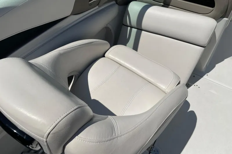Slide: The Image of White leather seat on 2011 Crownline 220LS boat, showcasing luxury and comfort. - 36