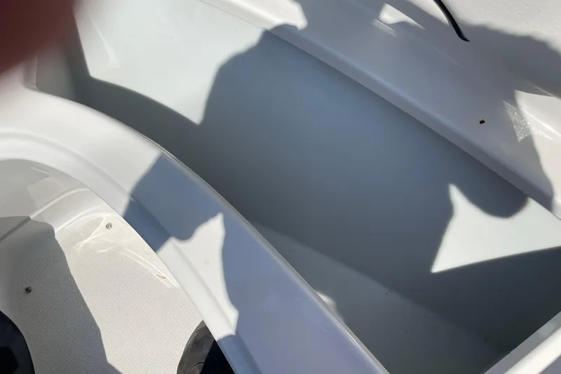 Slide: The Image of Interior view of a 2011 Crownline 220LS boat, showing seating area and shadows. - 39