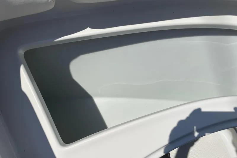 Slide: The Image of 2011 Crownline 220LS boat interior detail with shadow and white surface. - 40