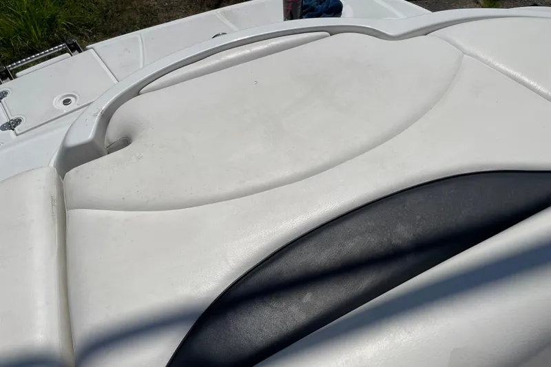 Slide: The Image of 2011 Crownline 220LS boat interior with white and black seating. - 41