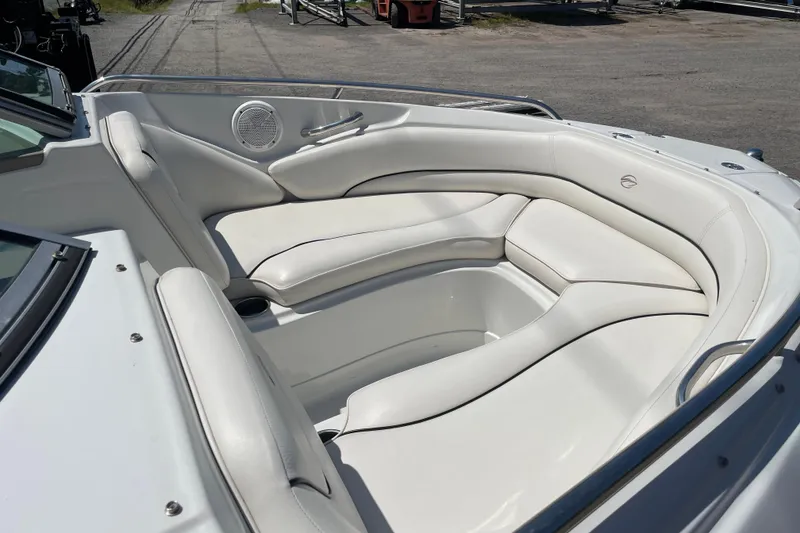 Slide: The Image of 2011 Crownline 220LS boat interior with white leather seating. - 45