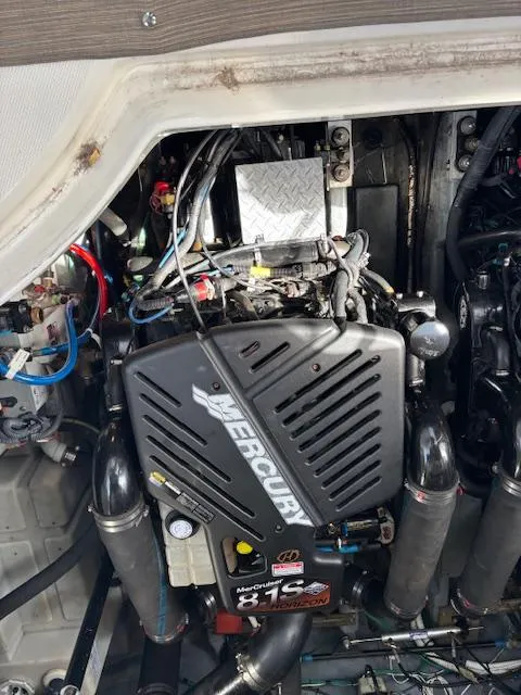 Slide: The Image of Engine compartment of a 2003 Sea Ray 340 Sundancer with Mercury engine. - 14