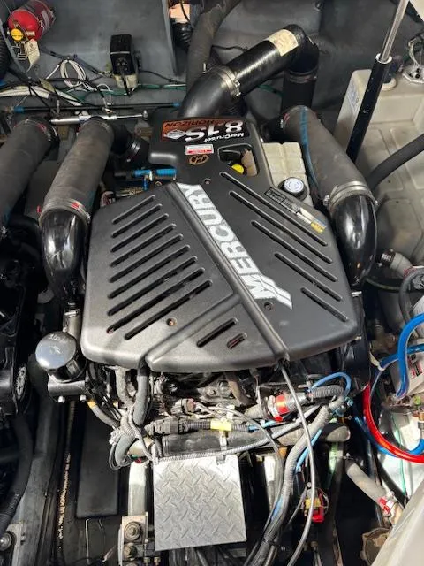 Slide: The Image of Engine of a 2003 Sea Ray 340 Sundancer boat, featuring a Mercury 5.7L V8. - 15